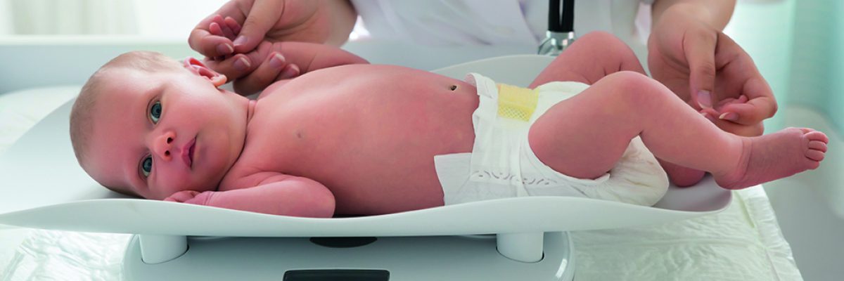 GRENOBLE Doctor Checking Weight Of Baby